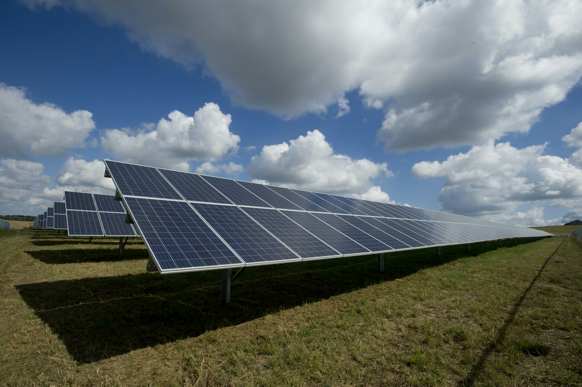 Large solar farm stretching toward the horizon