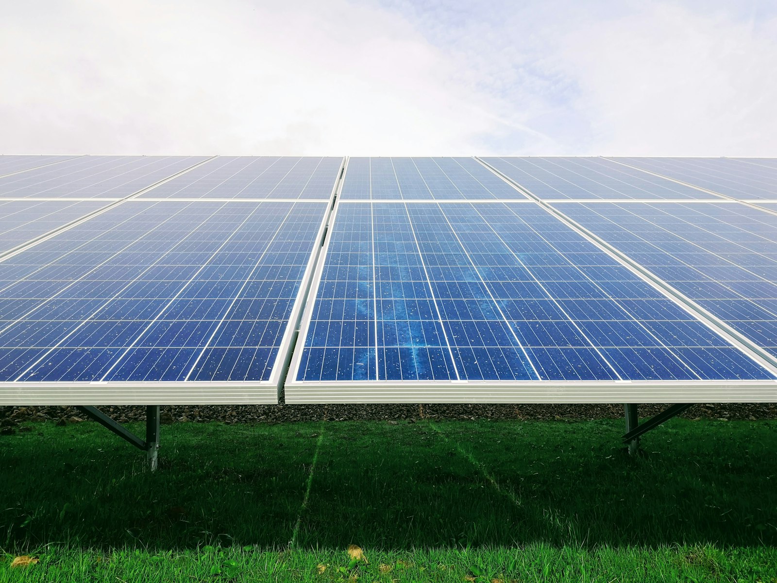 Standalone solar array on green land, powering off-grid sites