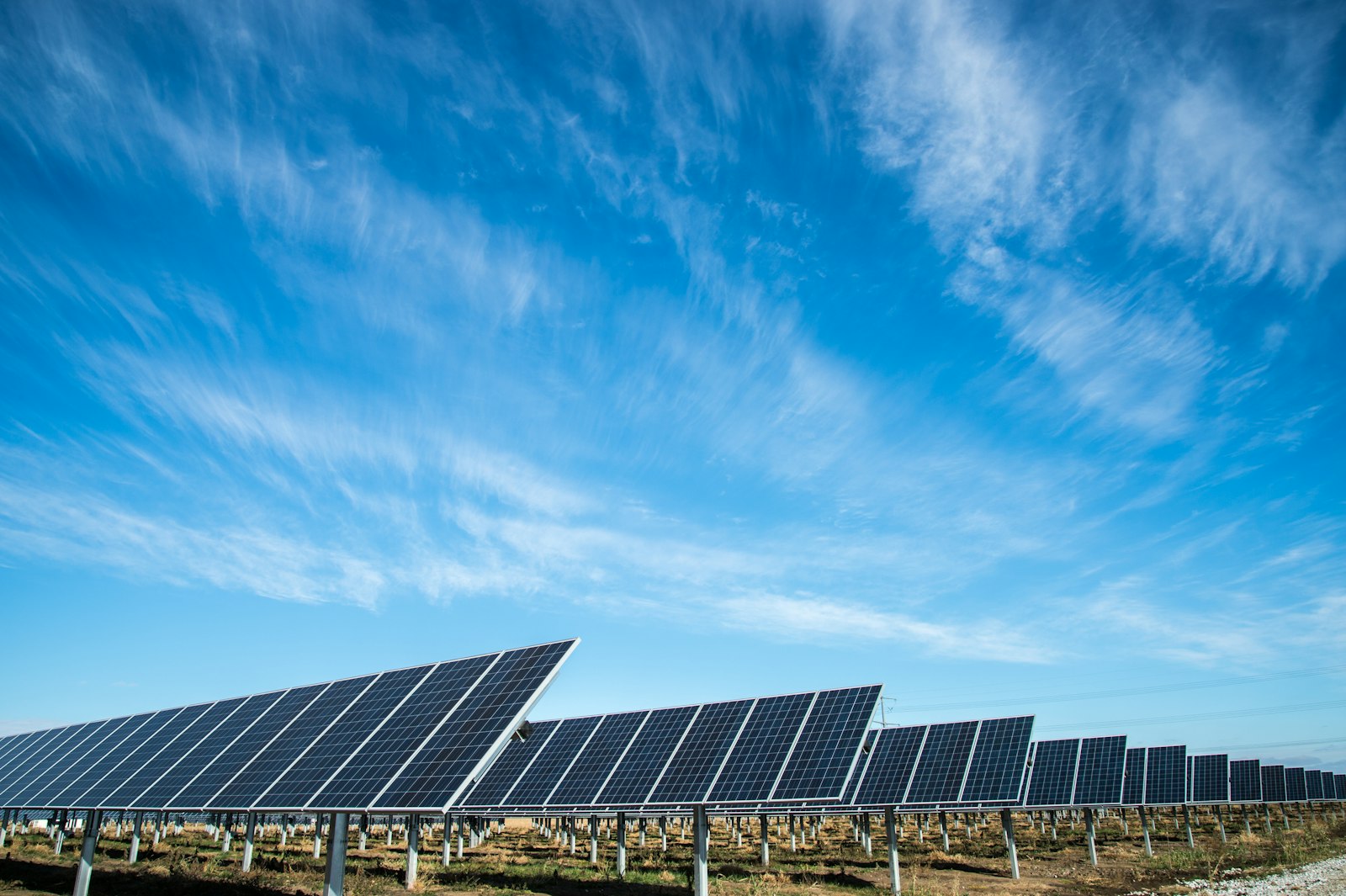 Rooftop solar panels connected to the grid under a clear sky