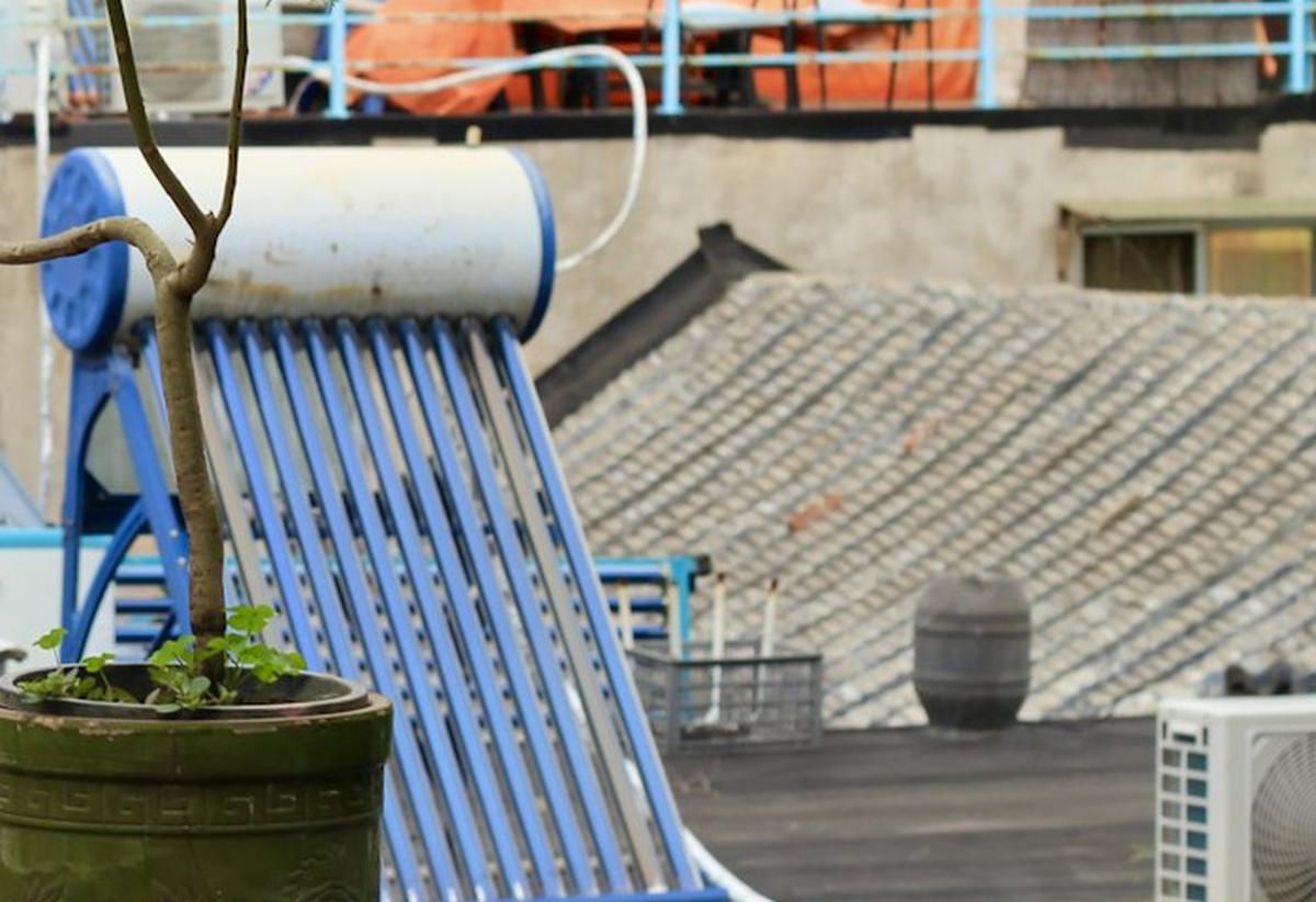 Rooftop solar water heater — storage tank and evacuated tubes